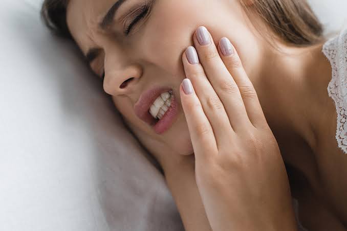 Why Does My Tooth Hurt When I Lay Down? Here's Why 2026